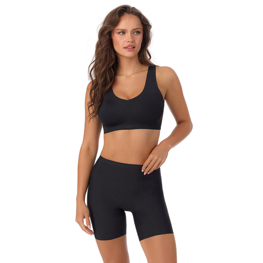 A Lady Wearing Cooling Comfort Active Wireless - Black facing front with a standing pose while looking to the side