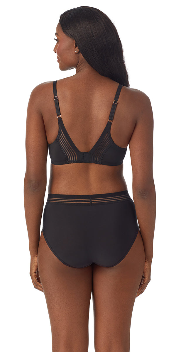 A lady wearing a black second skin back smoother.
