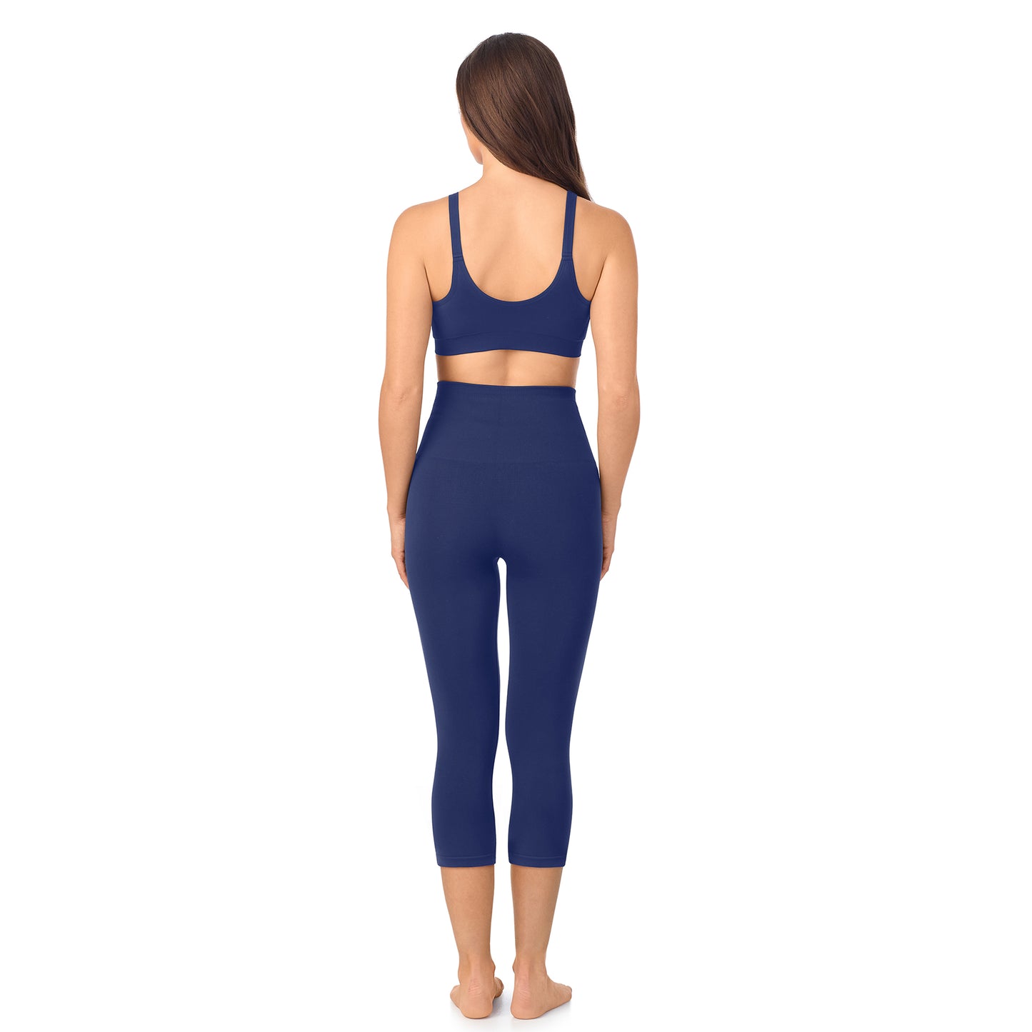 A lady wearing Seamless Comfort Smoothing 3/4 Legging in True Navy