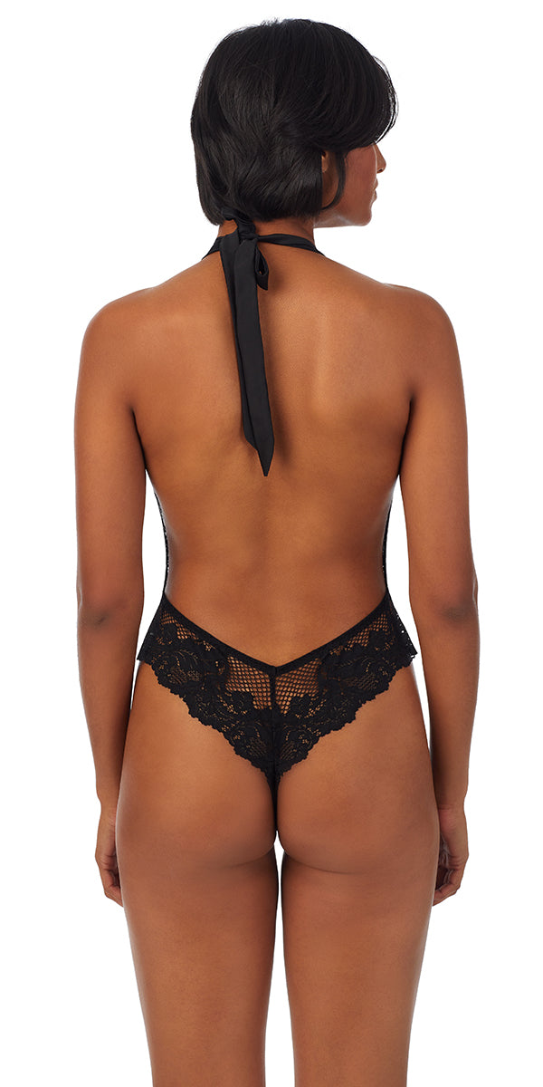 A lady wearing black LACE ALLURE HALTER BODYSUIT