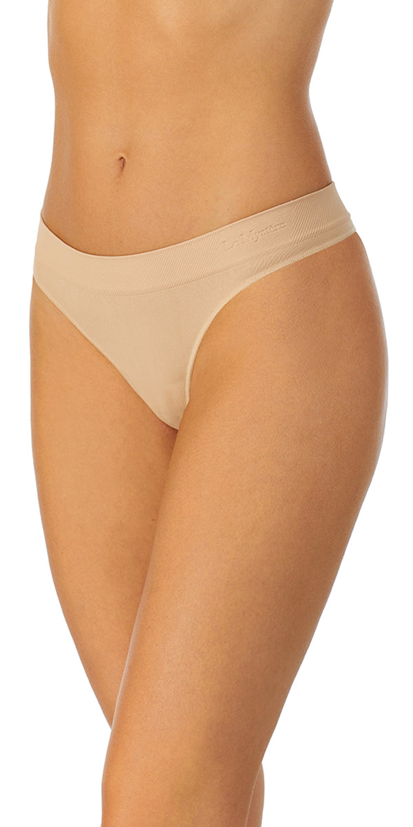 A lady wearing a natural Seamless Comfort Thong