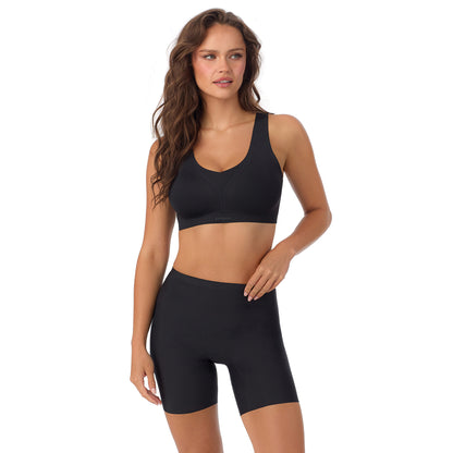 A Lady Wearing Cooling Comfort Active Wireless - Black facing front with a standing pose while looking to the side