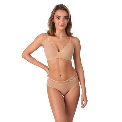 A lady wearing Second Skin Wireless Bra in Natural