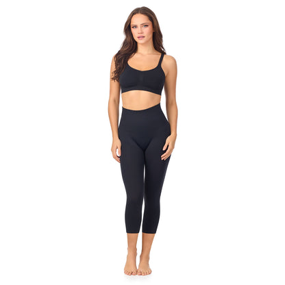 A lady wearing Seamless Comfort Smoothing 3/4 Legging in Black