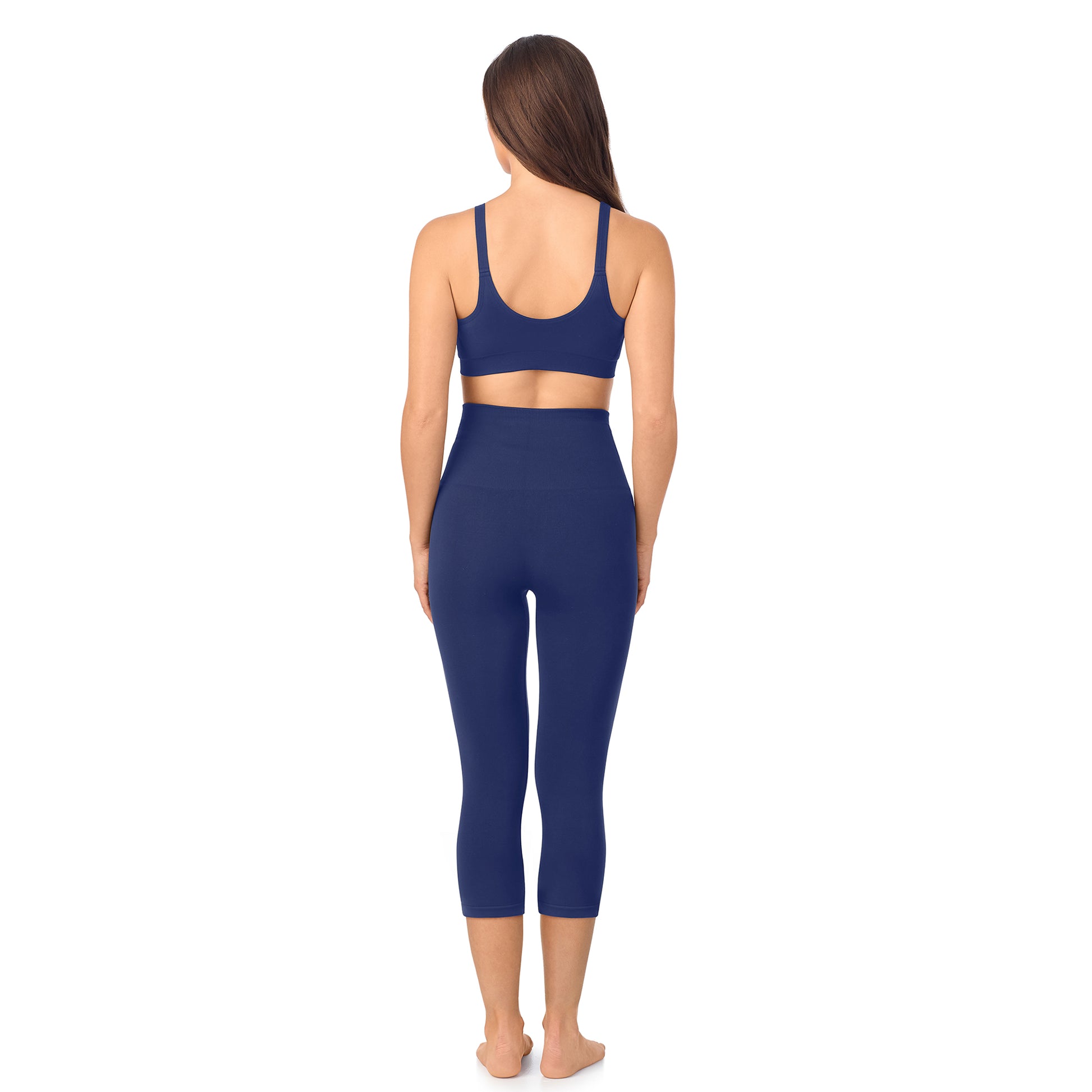 A lady wearing Seamless Comfort Smoothing 3/4 Legging in True Navy
