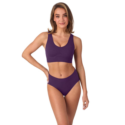 A lady wearing Seamless Comfort Wireless Back Smoother - Aubergine