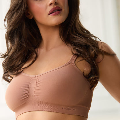 A lady wearing Seamless Comfort Bralette - Caramel