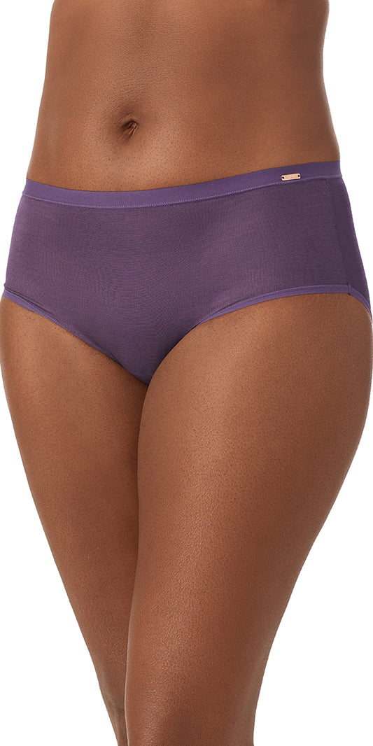 A lady wearing a dark plum Shimmer Mesh Brief