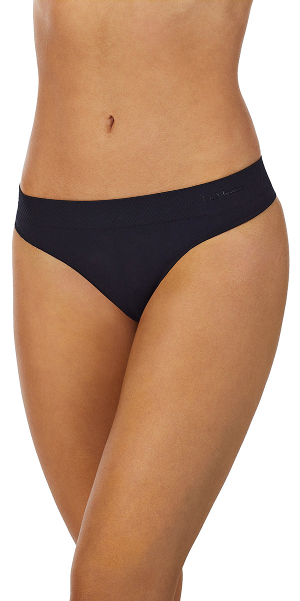 A lady wearing a black Seamless Comfort Thong