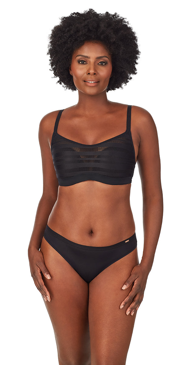 A lady wearing a black active balance sport bra.