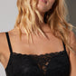 A lady wearing a black cotton touch wireless bra.