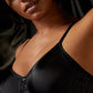 A lady wearing a black smooth profile bra.