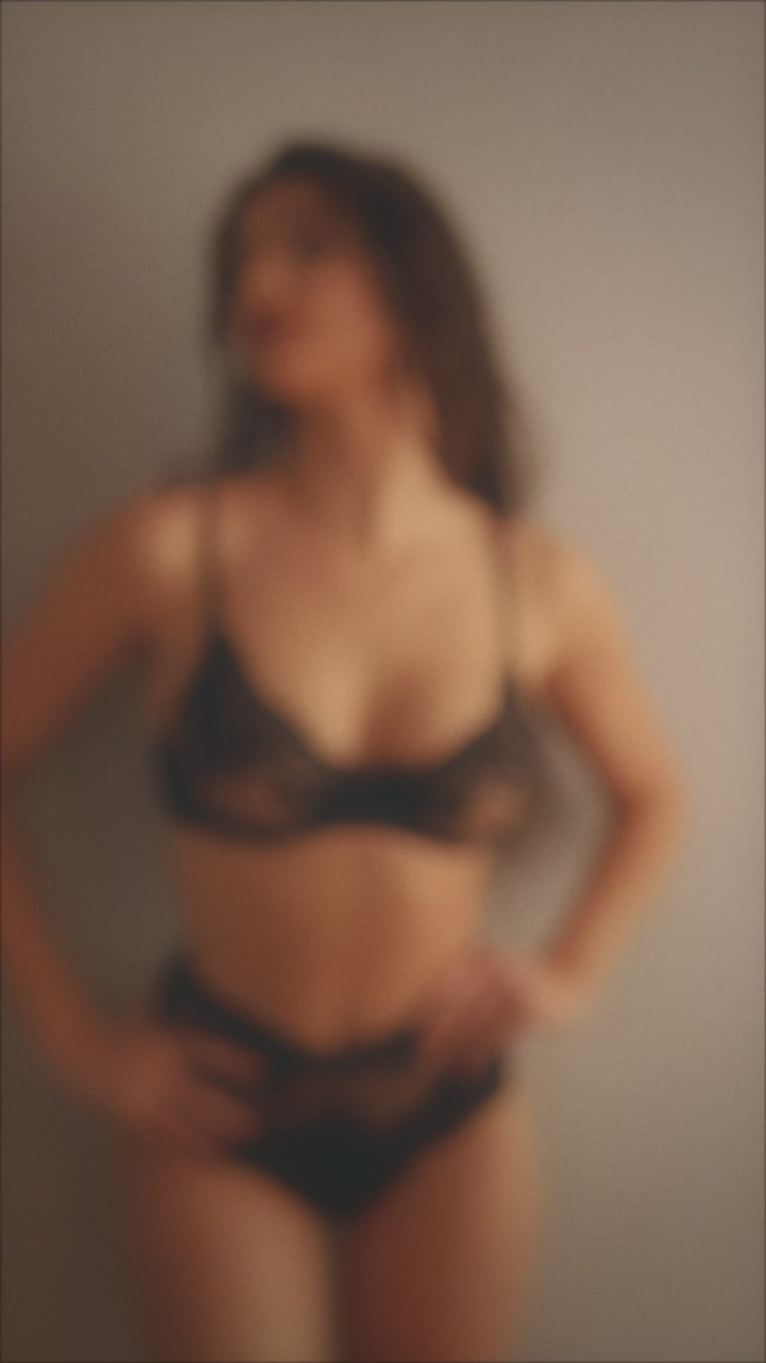 A lady wearing a black lace allure unlined.